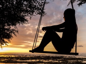 relaxing on a swing -holistic living - Faith Post